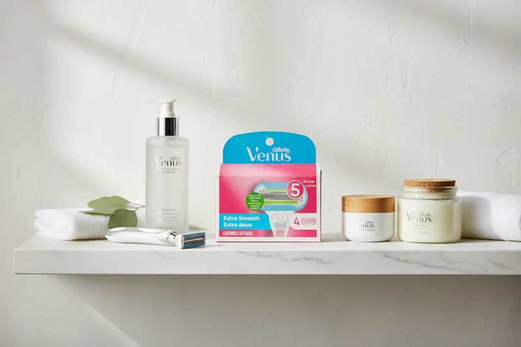 Bright spa aesthetic with organized women's shaving and skincare essentials on white marble shelf