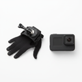 GoPro Hand + Wrist Strap black rotating mount on white surface next to GoPro HERO camera – More4less Outlet