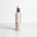 Daily skincare routine body cream pump bottle displayed with clean minimalist aesthetic on white marble surface