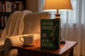 How to Say Babylon by Safiya Sinclair hardcover on wooden side table with cup of tea and reading lamp – More4less Outlet