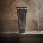 Lifestyle context image of Mary Kay Cityscape Hair and Body Wash (AI-generated for visual illustration only) – wet stone shower shelf with steam – More4less Outlet