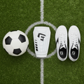 G-Form Pro-S Vento Shin Guards Large flat lay on soccer turf with white cleats and ball