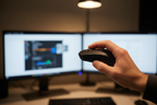 JLab Epic Mouse 2 ergonomic hand grip at dual-monitor workstation