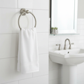 White cotton hand towel draped over Redmond brushed nickel towel ring in bright modern bathroom – More4less Outlet