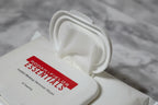 Close-up macro of easy-open dispense lid on white makeup remover wipes package