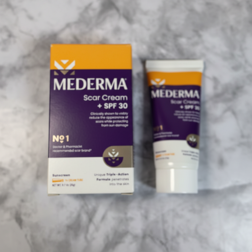 Mederma Scar Cream SPF 30 0.7 oz tube and box on a neutral stone surface