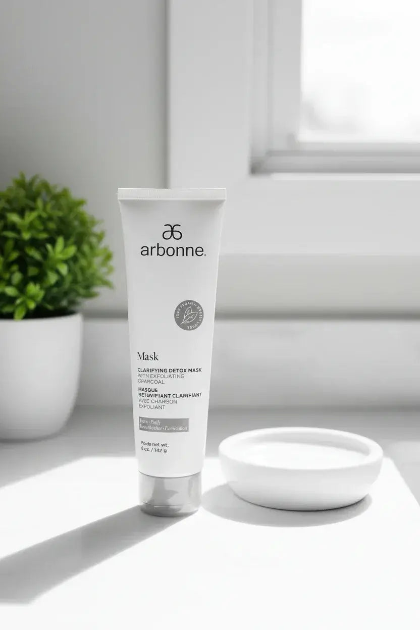 Arbonne Clarifying Detox Mask tube displayed on white surface with green plant lifestyle setting - More4less Outlet