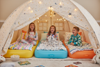 Kids happy in sleeping tent with colorful inflatable air beds