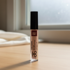 Arbonne Glossed Over Lip Gloss in Anise 0.1 fl oz on a clean makeup vanity