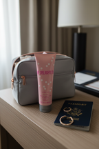 Mary Kay Be Delighted Body Wash 4 fl oz in travel toiletry bag on hotel nightstand – More4less Outlet