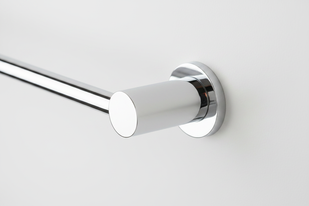 Close-up of Delta Ara polished chrome towel bar end bracket — high-shine corrosion-resistant finish detail