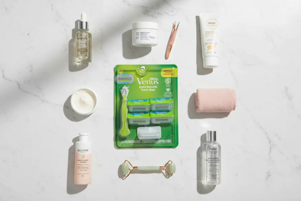 Professional flat lay of women's personal care and beauty supplies including razor and grooming essentials on white marble