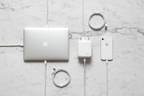 Belkin BOOST↑CHARGE 68W GaN wall charger white flat lay on marble with MacBook iPhone and USB-C cables — More4less Outlet