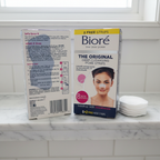 Bioré Original Deep Cleansing Nose Pore Strips two-box bundle beside plain cotton rounds on a marble bathroom shelf