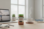 Nature's Truth Lion's Mane Gummies jar on modern office desk with laptop and coffee cup