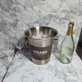 Houdini by Rabbit stainless steel champagne bucket on marble counter with champagne bottle and crystal flutes – More4less Outlet