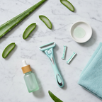 Modern lifestyle flat lay with sensitive skin personal care items in aqua tones on marble