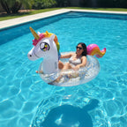PoolCandy Glitter Unicorn pool tube floating in sunny backyard swimming pool