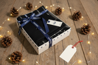 Dockers Scarf & Beanie Winter Set black plaid displayed as holiday gift on rustic table with pine cones and fairy lights – More4less Outlet