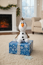 Disney Frozen Olaf interactive plush on blue and white birthday gift box
