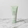Mary Kay Mint Bliss lotion tube on polished marble surface – studio product shot
