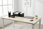 Officemate black plastic desk organizer set on clean organized home office desk with natural light