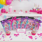 Six Barbie Extra fashion sticker pads arranged as party favor gifts with pink and purple ribbon bows on birthday party table