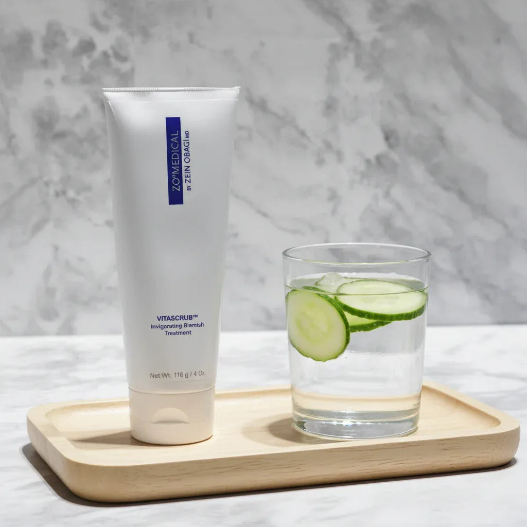 ZO Medical Vitascrub on minimalist wood tray with cucumber water