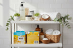 Aesthetic bathroom shelf with premium personal care items, fresh greenery and coconut accents