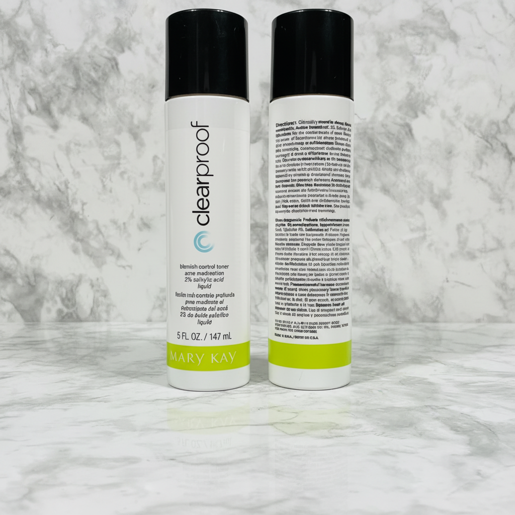 Two Mary Kay Clear Proof Blemish Control Toner 5 oz bottles standing side-by-side on marble countertop