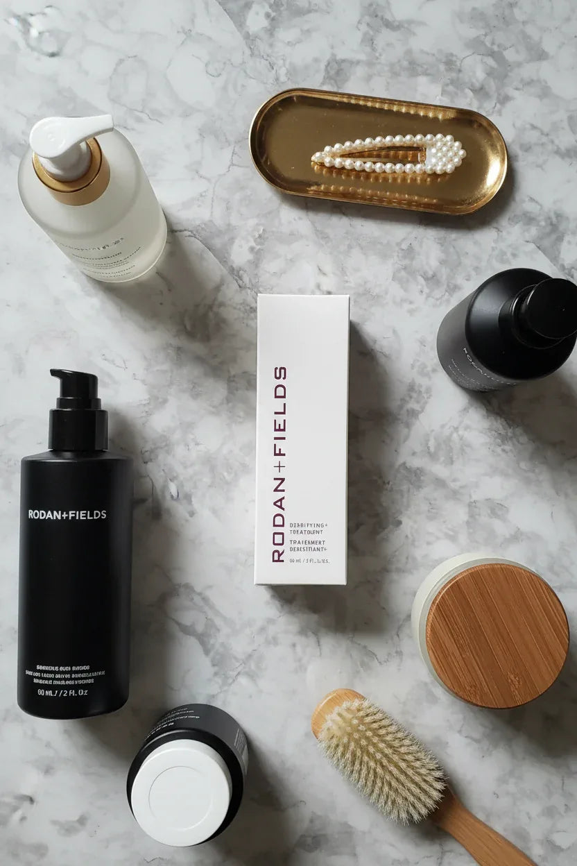 Rodan + Fields Densifying+ Treatment on organized vanity area with luxury haircare products and minimalist stone background
