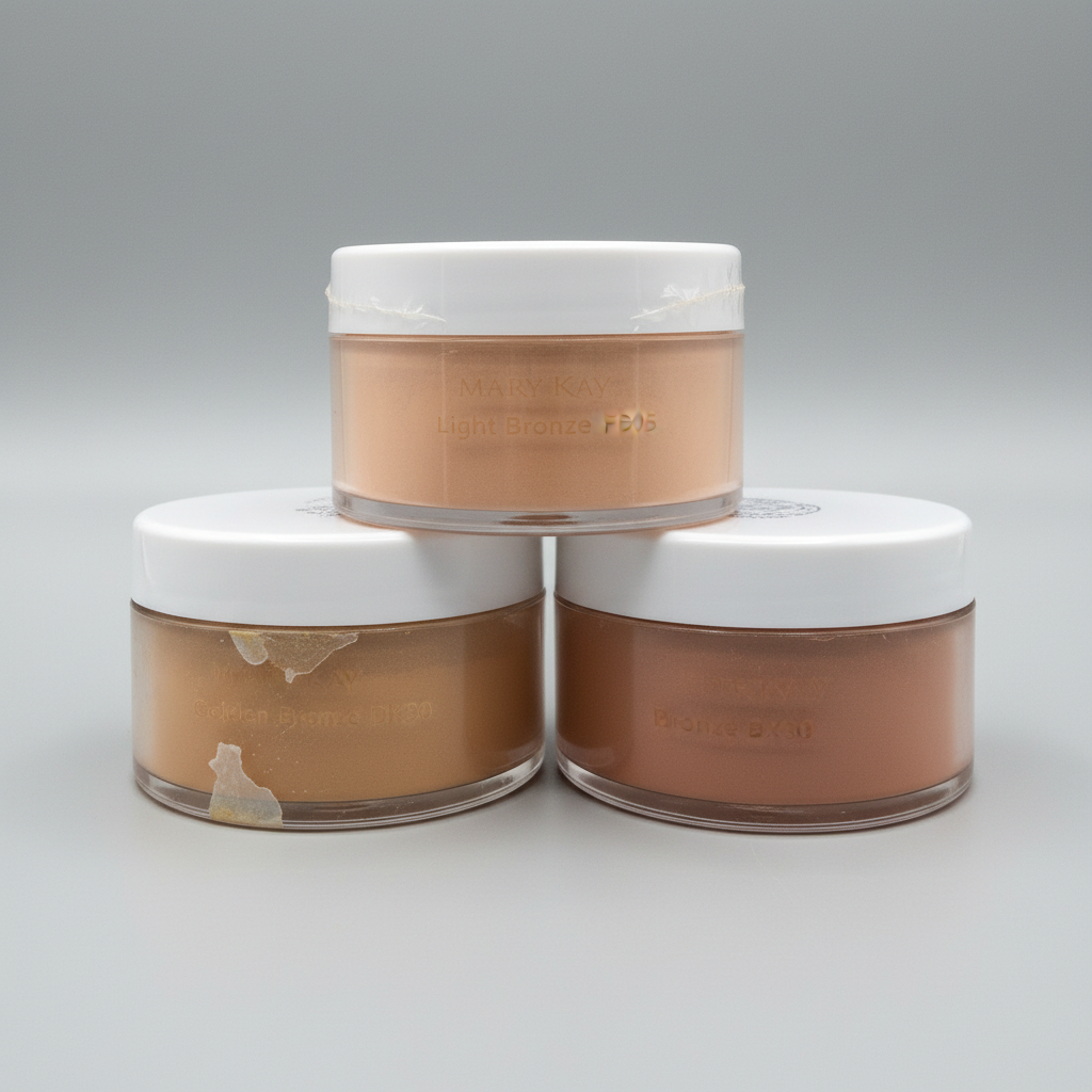 Three Mary Kay Signature loose powder jars in Light Bronze, Bronze, and Golden Bronze shades on a neutral background