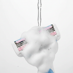 Close-up of soap gel bars dissolving into rich white lather on a razor cartridge