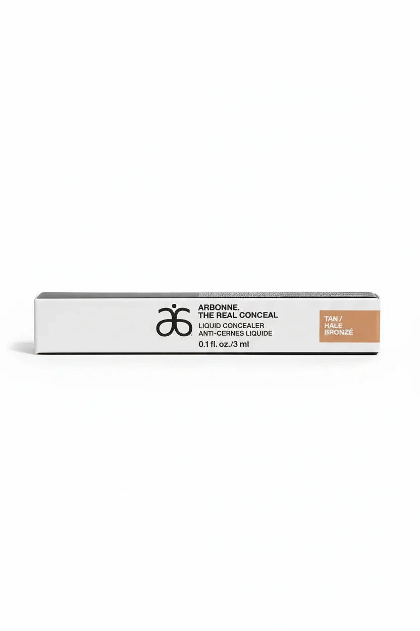 Arbonne The Real Conceal Liquid Concealer Tan white studio backdrop product shot