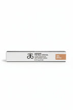 Arbonne The Real Conceal Liquid Concealer Tan white studio backdrop product shot