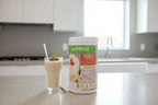 Herbalife Formula 1 Select Natural Vanilla canister on a clean bright breakfast bar in a minimalist modern kitchen