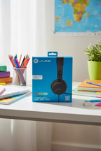 JLab JBuddies Learn headphones on desk with school supplies pencils and notebook
