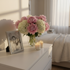 Silver picture frame on a white dresser with fresh flowers and soft candles