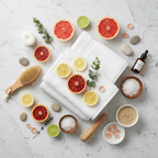 Flat-lay of natural spa accessories, citrus accents, and white towels on clean marble surface