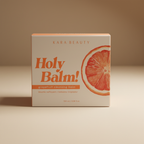 Kara Beauty Holy Balm grapefruit cleansing balm box on a softly lit neutral surface
