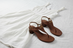 Lauren Ralph Lauren Westcott Polo Tan leather heeled thong sandals styled on white linen with a flowing summer dress