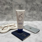 Premium beauty flat-lay with ZO Skin Health cleanser, iPhone and silk eye mask