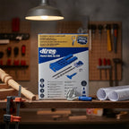 Kreg Pocket-Hole Jig 320 retail box and Face Clamp on dark-oak shelf near wood furniture repair project and workshop blueprints