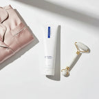ZO Medical Foamacleanse skincare flat-lay with silk pajamas and marble facial massager