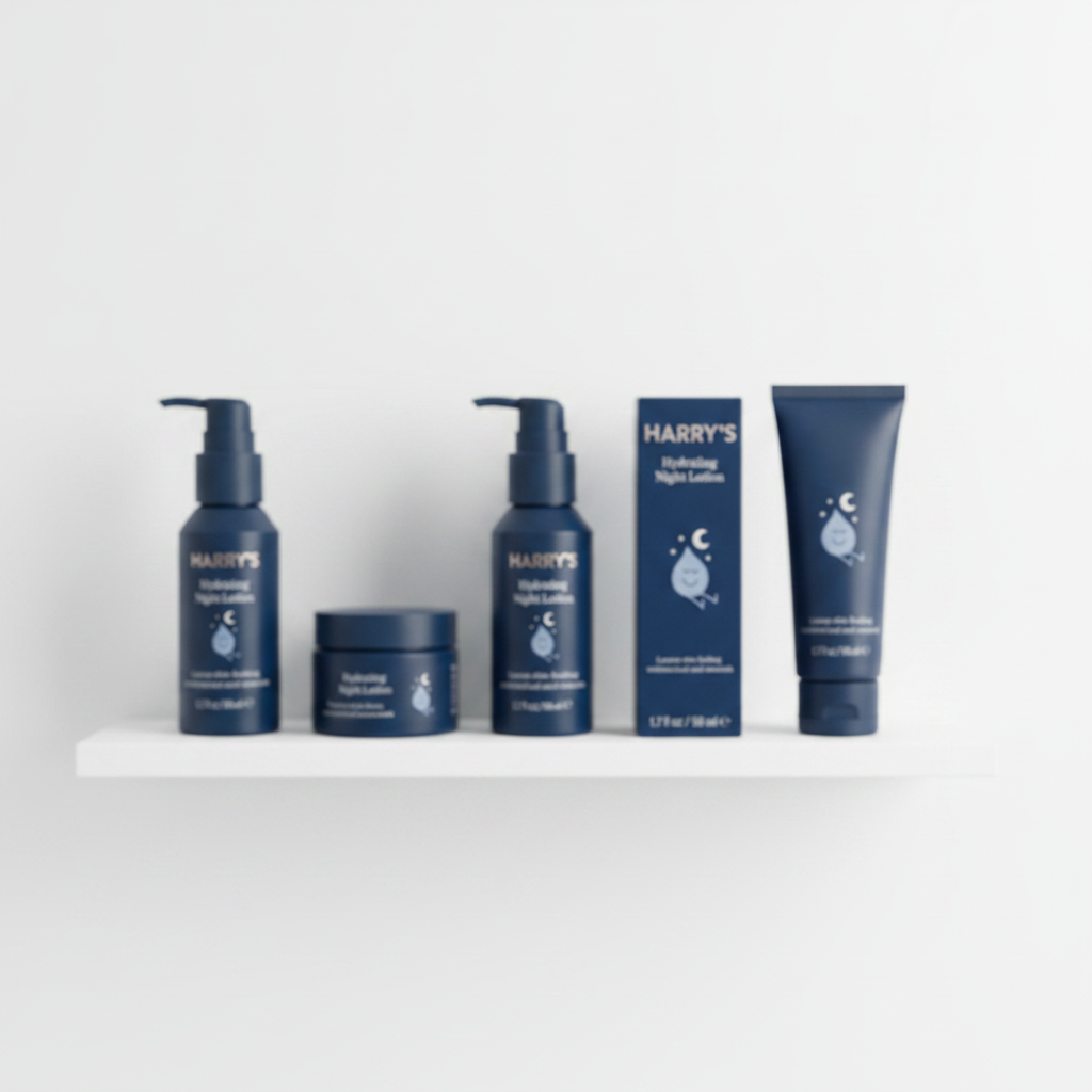 Minimalist shelf of premium men's personal care products in soft focus with dark navy blue bottles