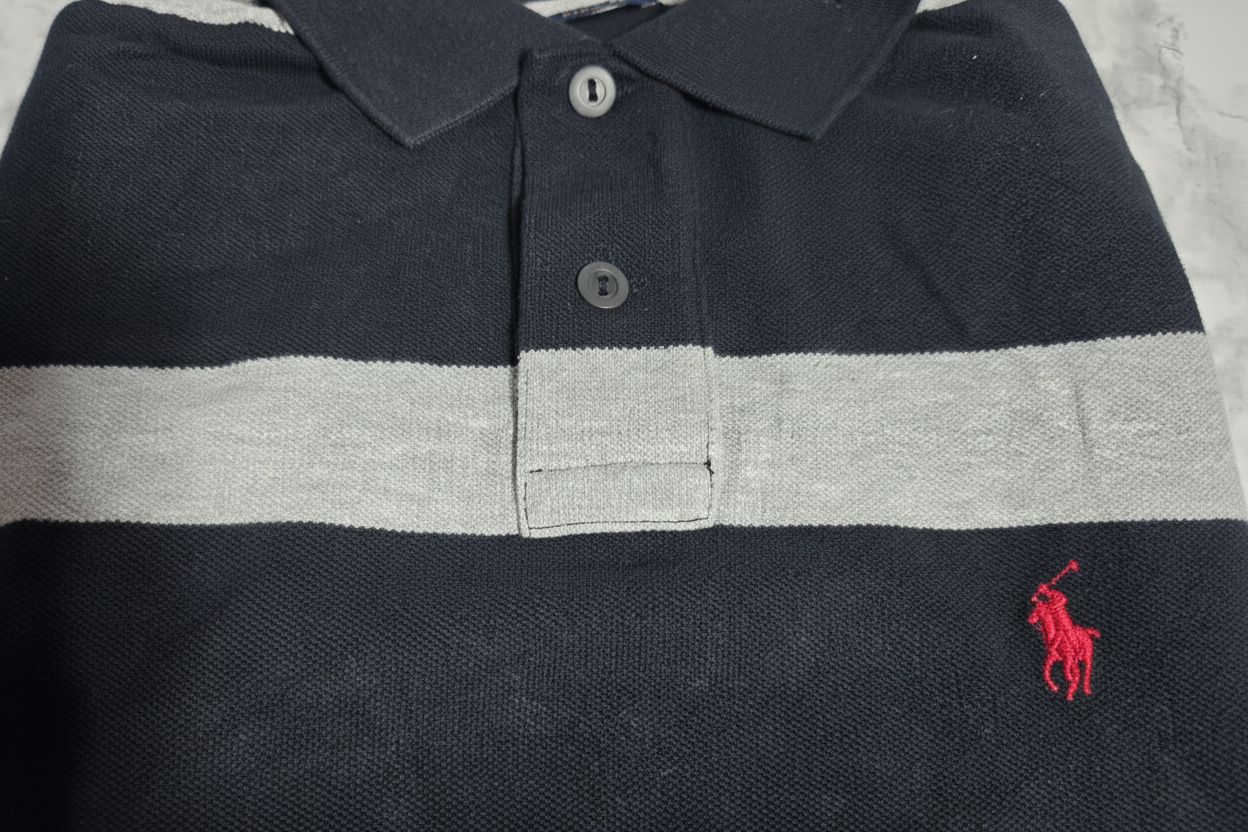 Close-up of Polo Ralph Lauren Custom Fit striped polo red polo pony embroidery and two-button placket on black grey stripe fabric – More4less Outlet