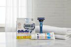 Gillette SkinGuard 8ct blade refills on marble bathroom counter with razor handle lifestyle