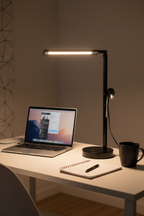 Room and Retreat 16-inch black LED desk lamp illuminated on modern home office desk with laptop notebook and coffee