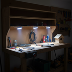 Good Earth LED puck lights under workshop shelving task lighting