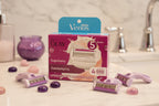 Premium women's razor cartridges resting on a white marble bathroom vanity with purple sugarberry color accents